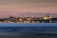 A scenic view of Istanbul's skyline at sunset with silhouettes of historic buildings.