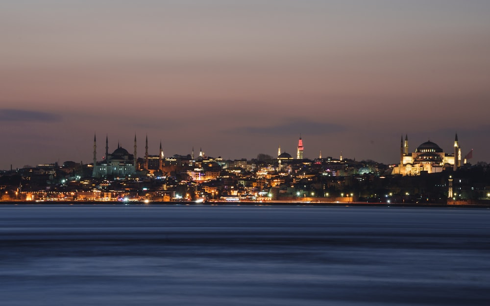 a view of a city at night from across the water