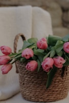 Bright and colorful artificial tulips arranged in a rustic basket.