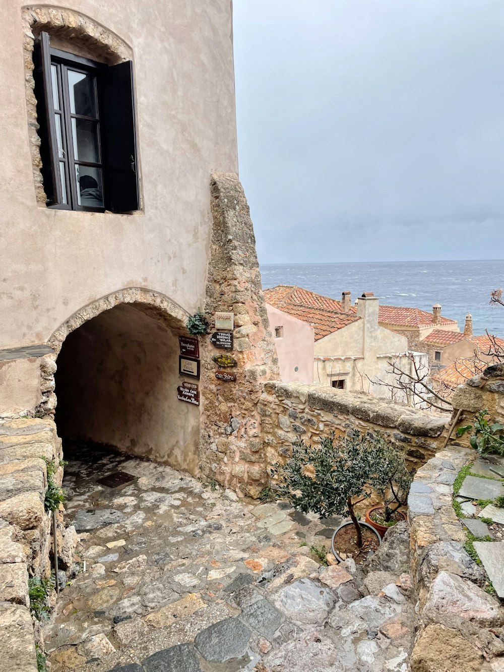 a stone building with a window on the side of it