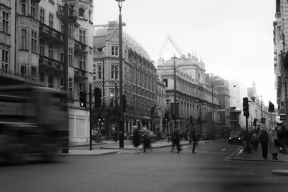 a black and white photo of a busy city street