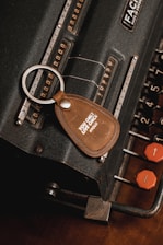 a keychain with a leather tag attached to it
