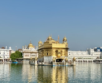 a large body of water with a building in the background