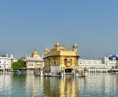 a large body of water with a building in the background