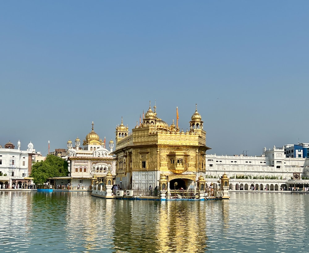 a large body of water with a building in the background