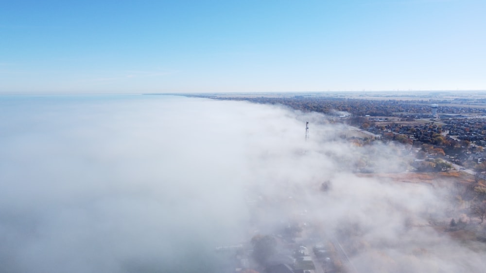 an aerial view of a city in the clouds