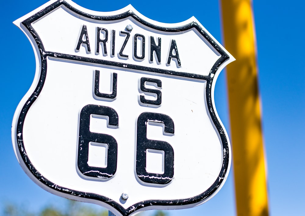 a close up of a street sign with a sky background