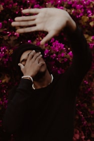 a person with their hand on their face