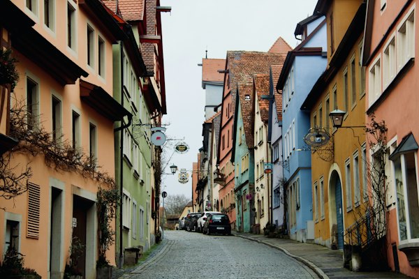 A car is parked on the side of a narrow street — Rothenburg ob der Tauber, Germany