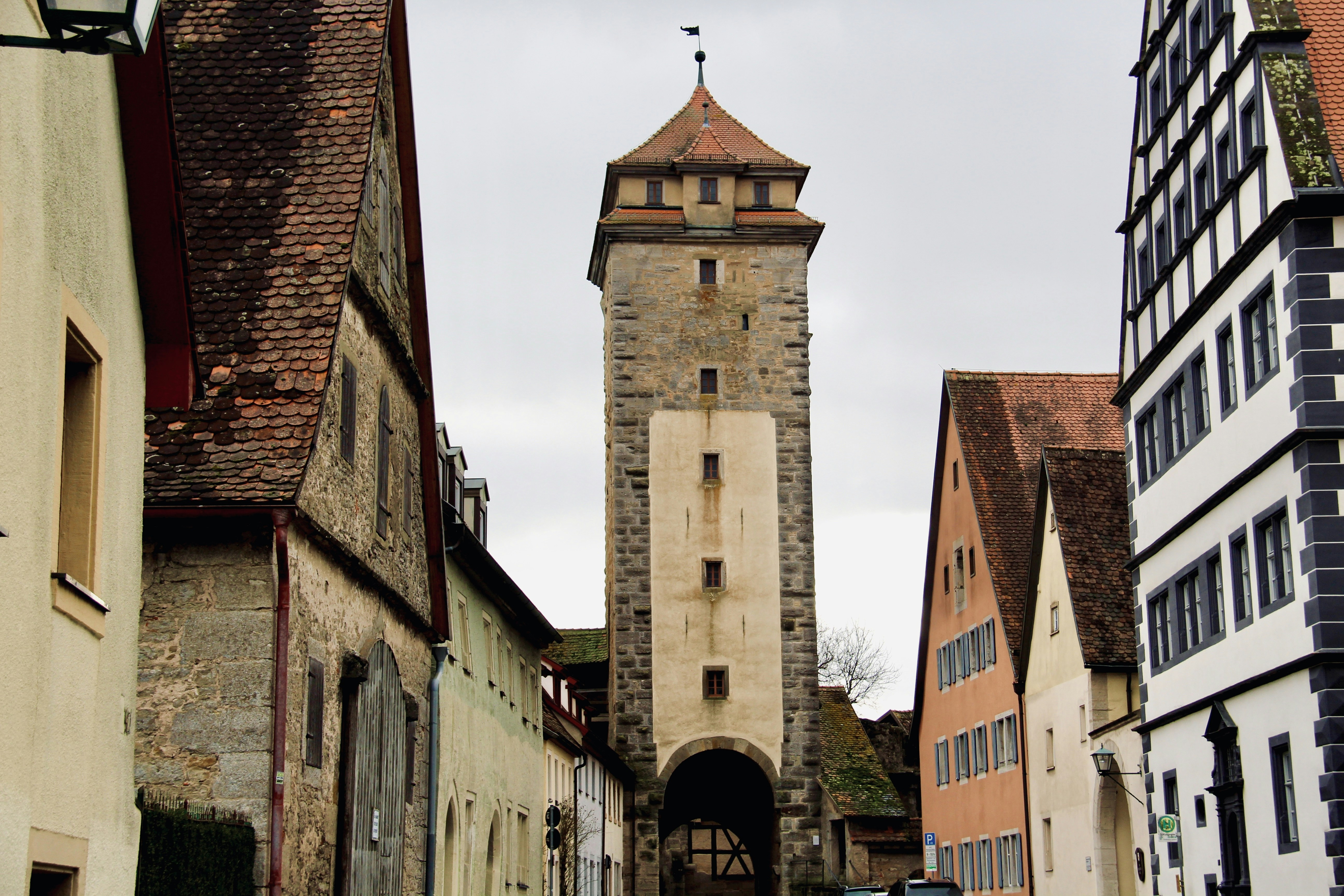 a tall clock tower towering over a city, 