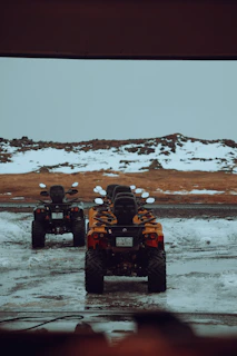 A selection of rugged ATVs and dirt bikes lined up outside the family-owned dealership