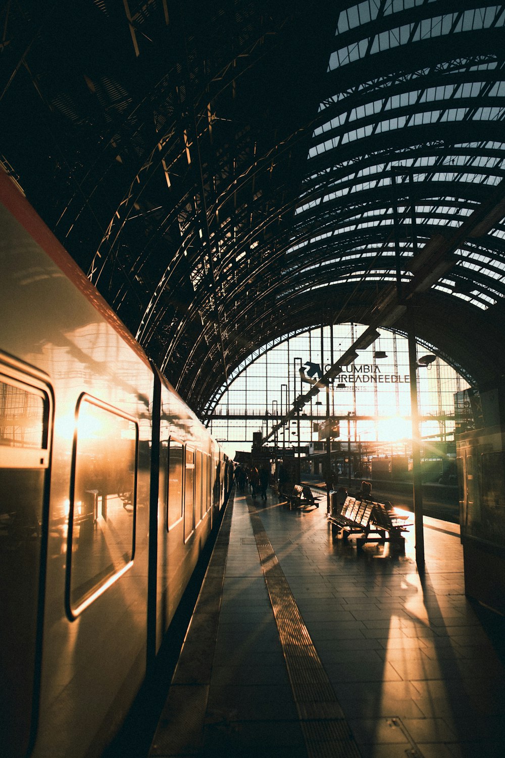 a train parked in a train station next to a platform