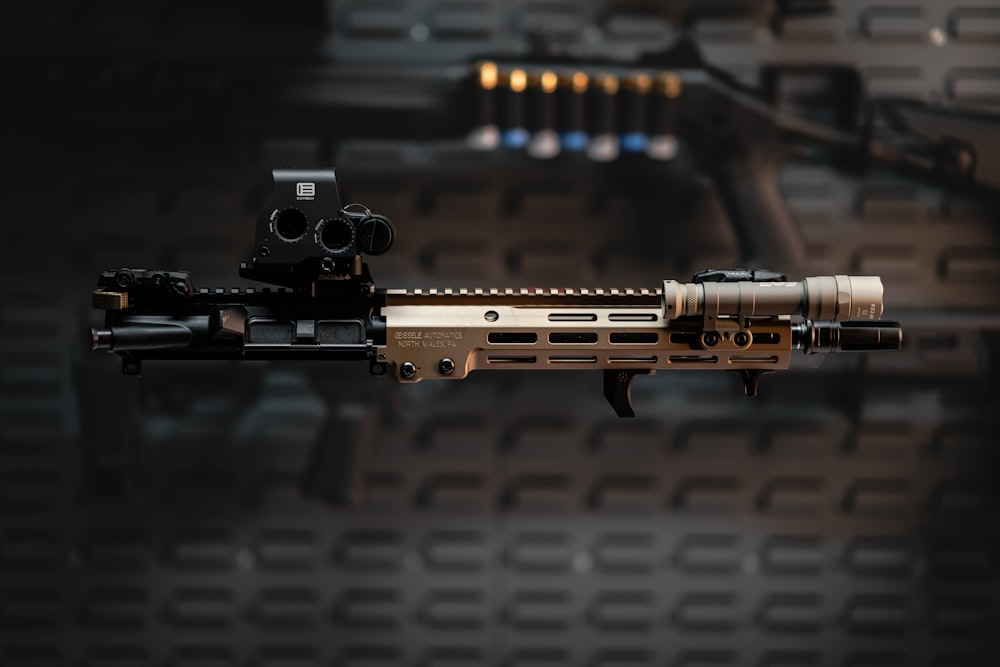 a close up of a rifle on a black background
