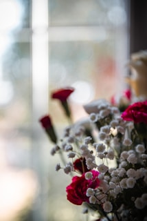 A close-up of a beautifully arranged floral bouquet in soft lighting.