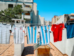 a row of clothes hanging on a clothes line