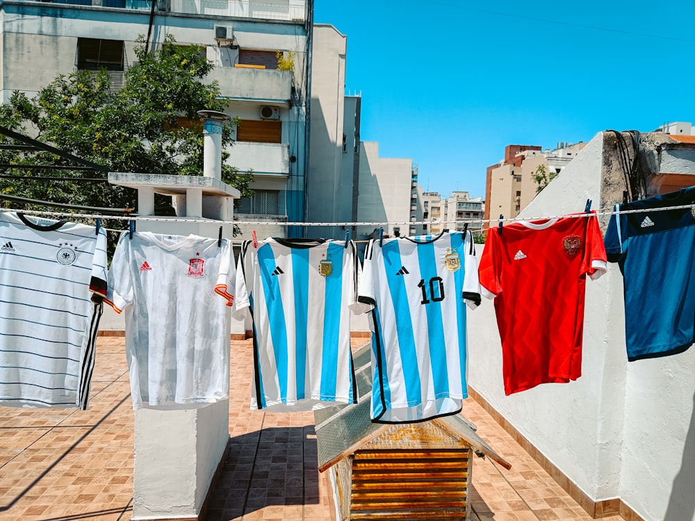 a row of clothes hanging on a clothes line