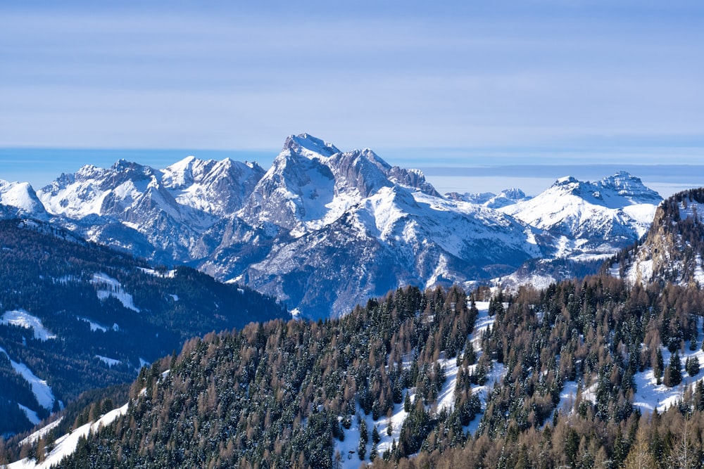 a view of a mountain range covered in snow