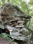 A beautifully crafted artificial rock formation in a park.
