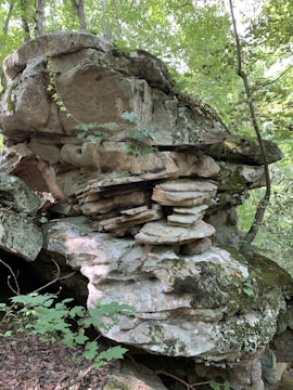 A beautifully crafted artificial rock formation in a park.