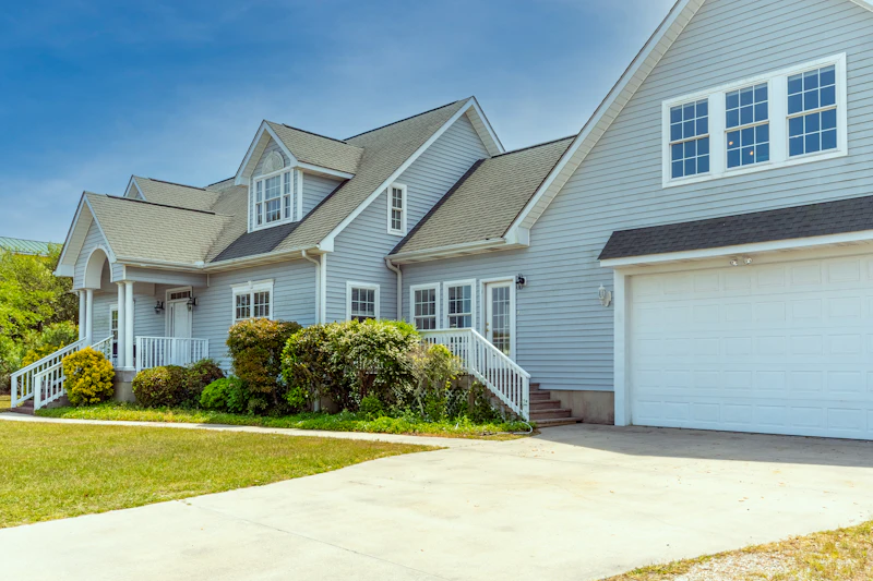 white rental house with large driveway