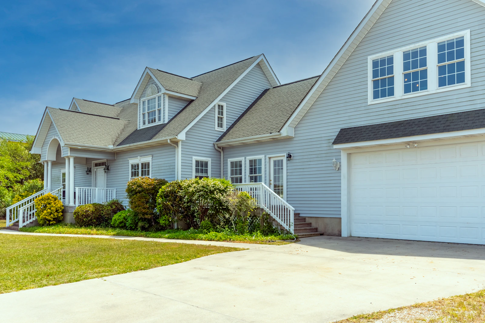 A house and driveway illustrating multiple home security monitoring areas