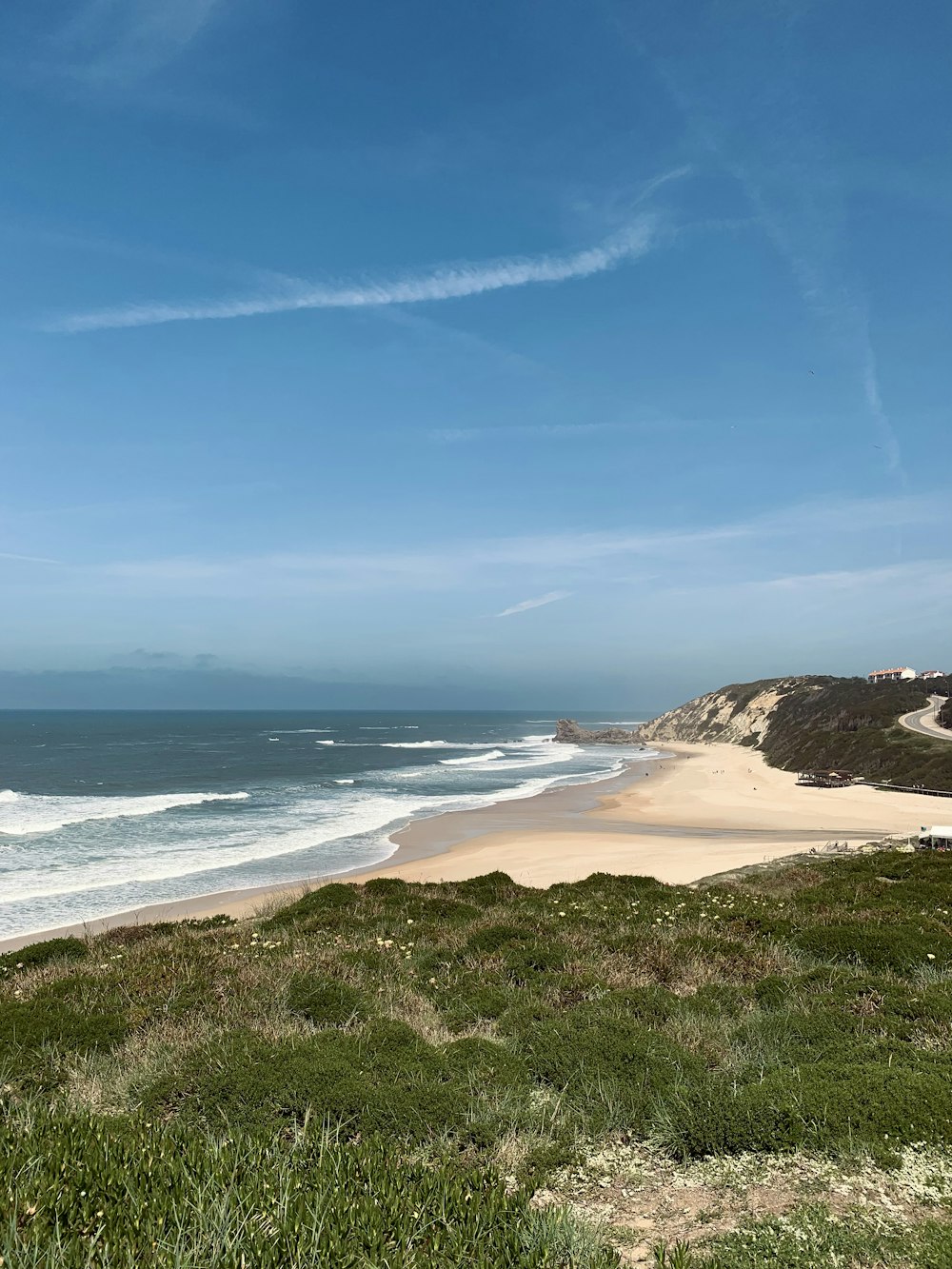 a view of a sandy beach and the ocean