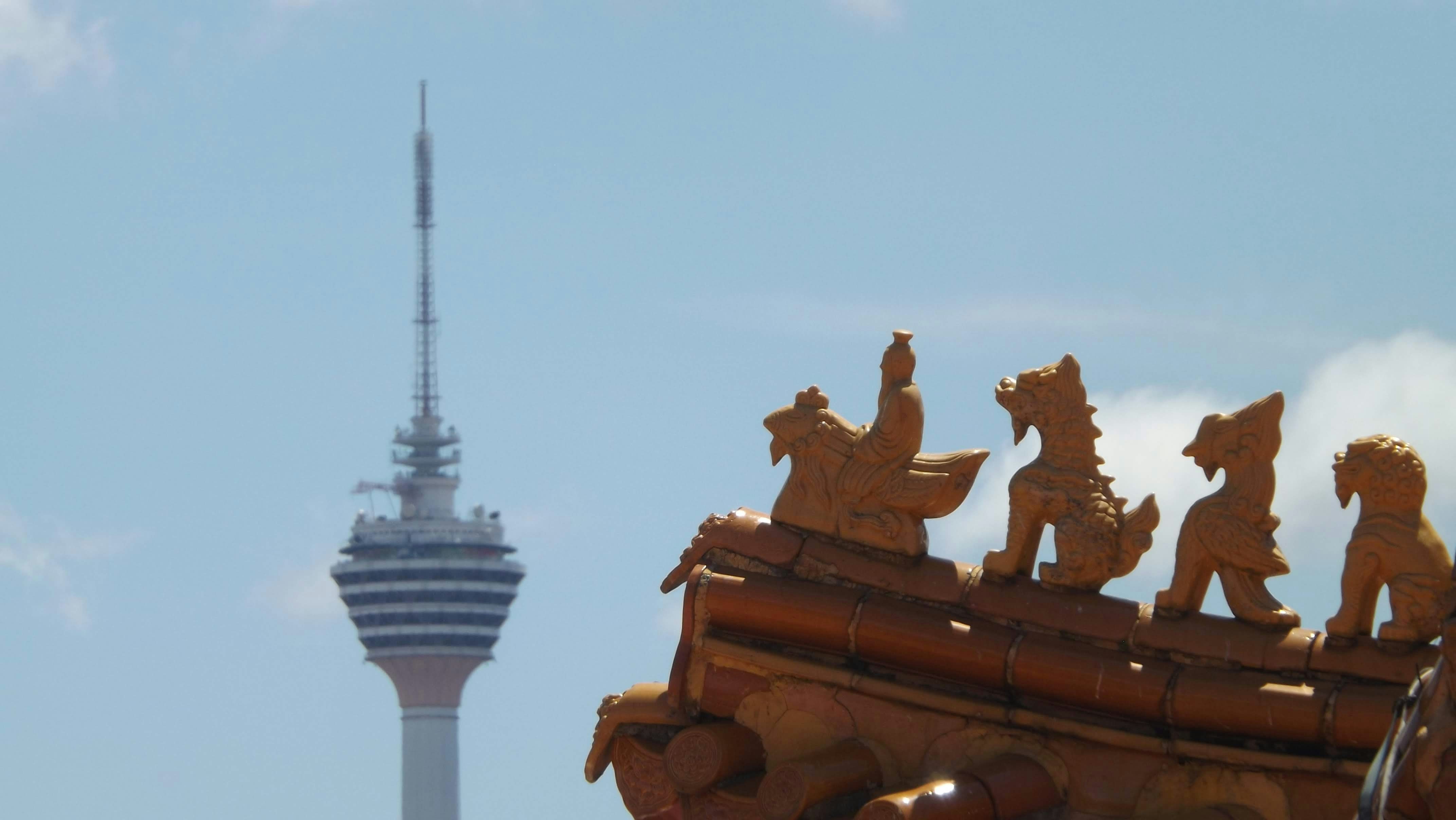 a building with a tower in the background