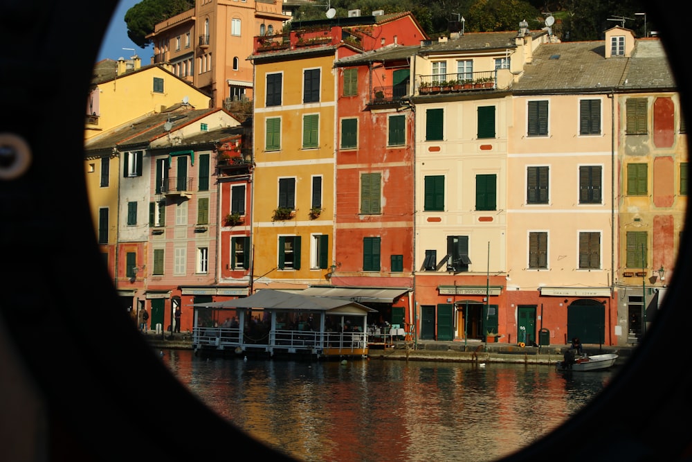 a view of a body of water with buildings in the background