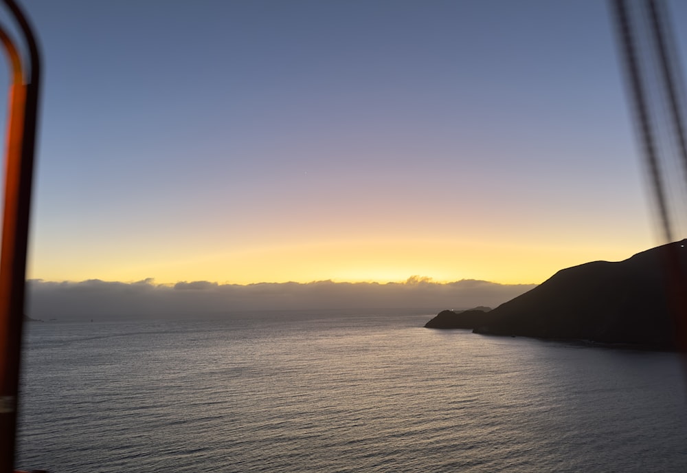 a view of a body of water at sunset