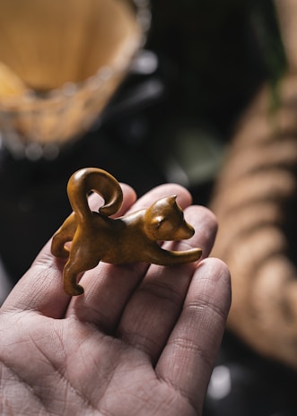 A delicate, hand-painted 3D pet figurine showcasing fine details and a warm ivory background.