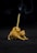A small, brown ceramic cat figurine is designed to hold an incense stick, which is lit and releasing wisps of smoke. The cat has a playful pose with its tail curled upwards to support the incense stick.