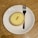 A close-up of a delicious lemon tart on a wooden table.