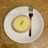 A close-up of a delicious lemon tart on a wooden table.