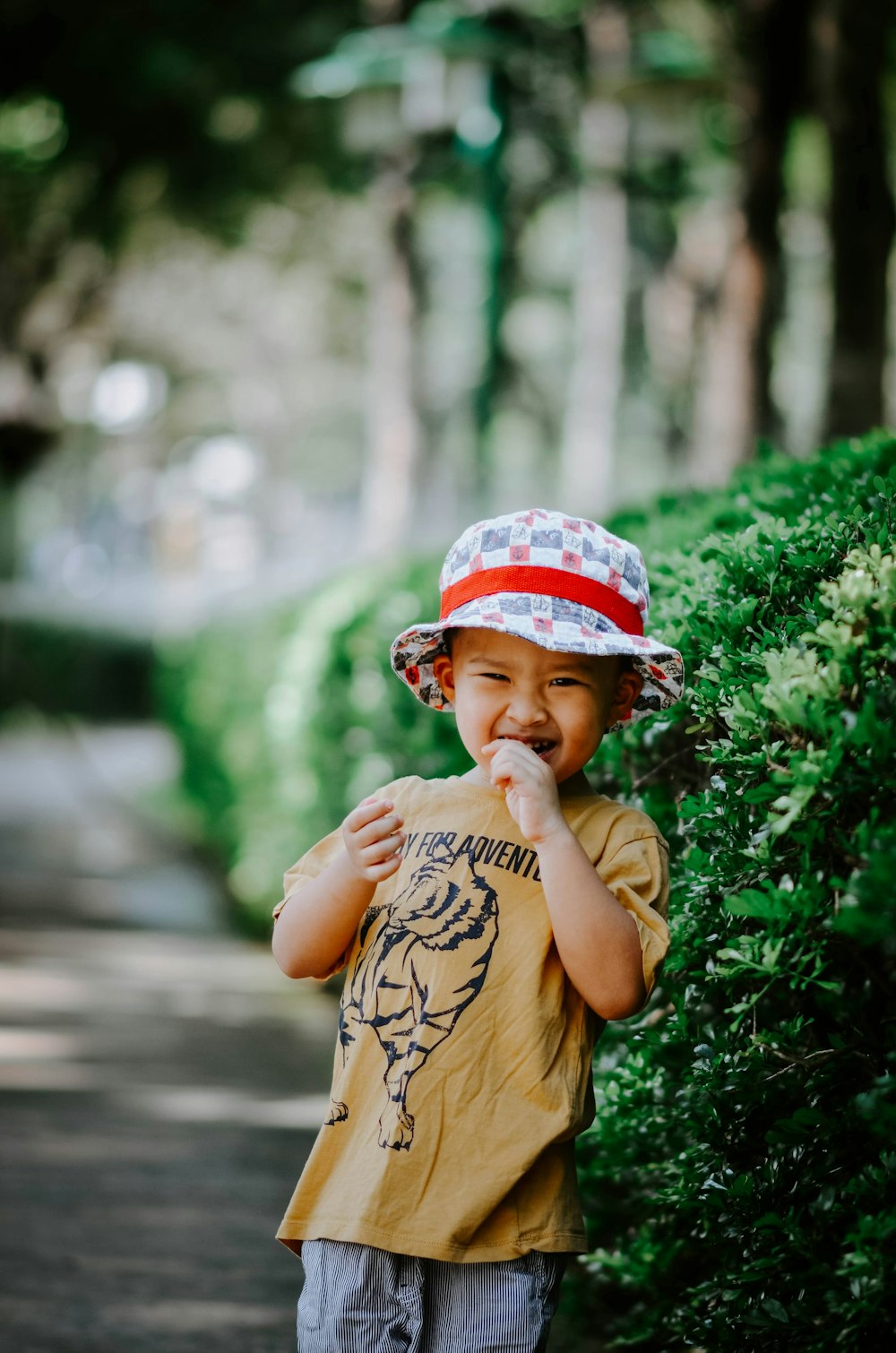 a little boy that is standing in the dirt