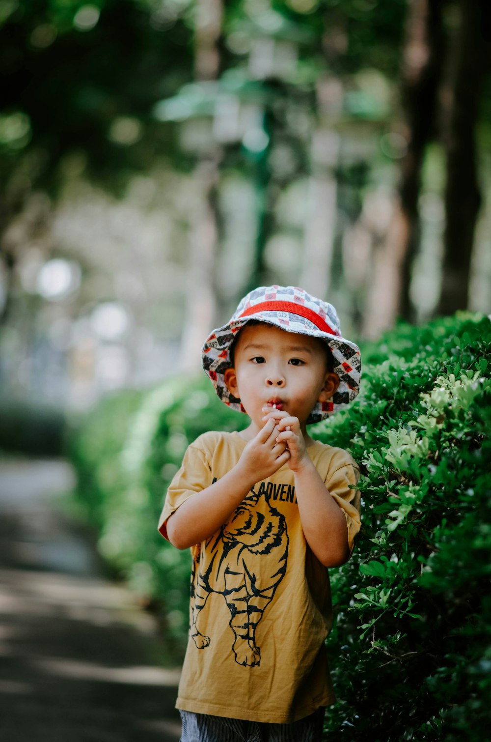 a little boy that is standing in the dirt