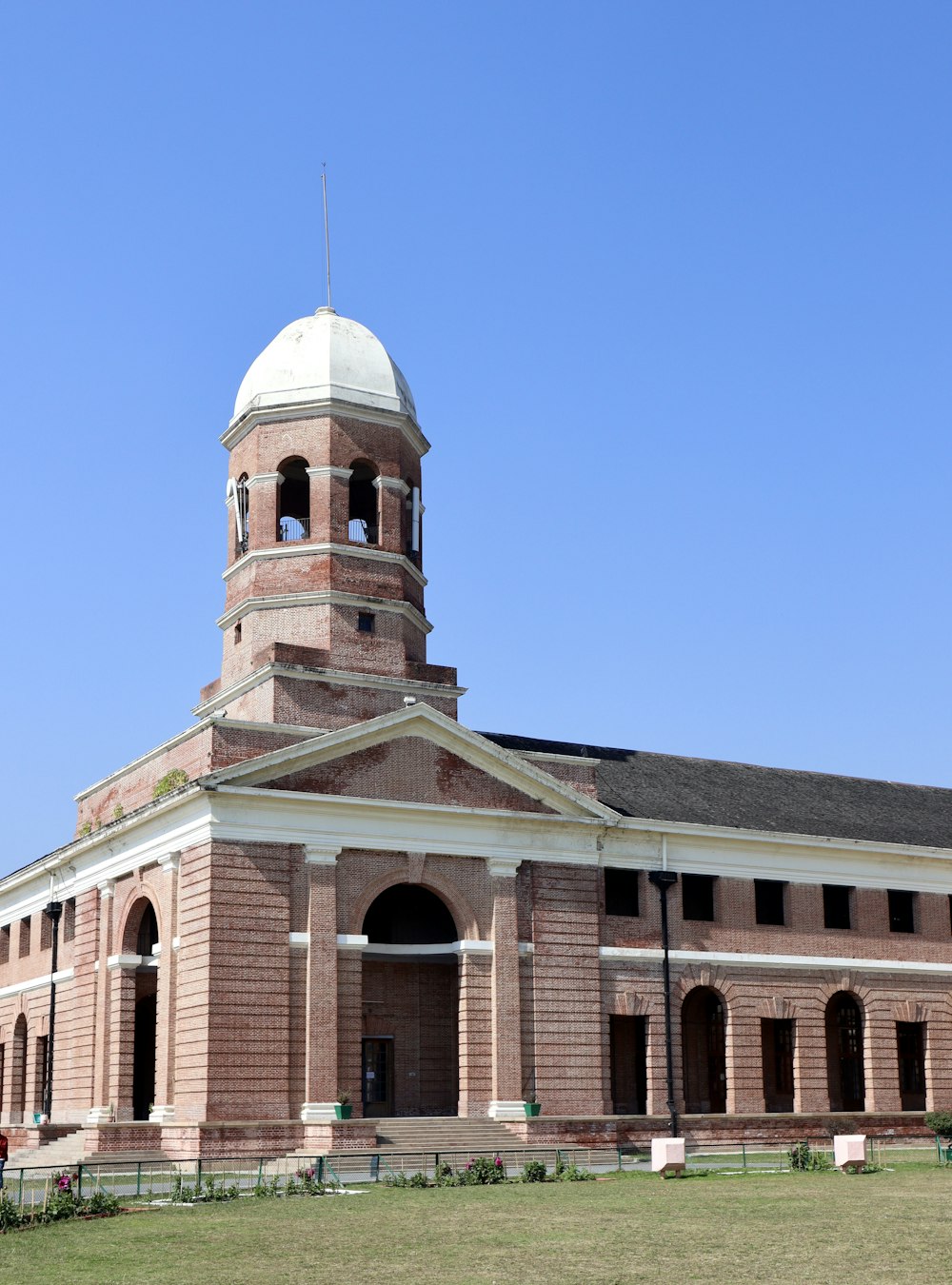 a large brick building with a clock tower