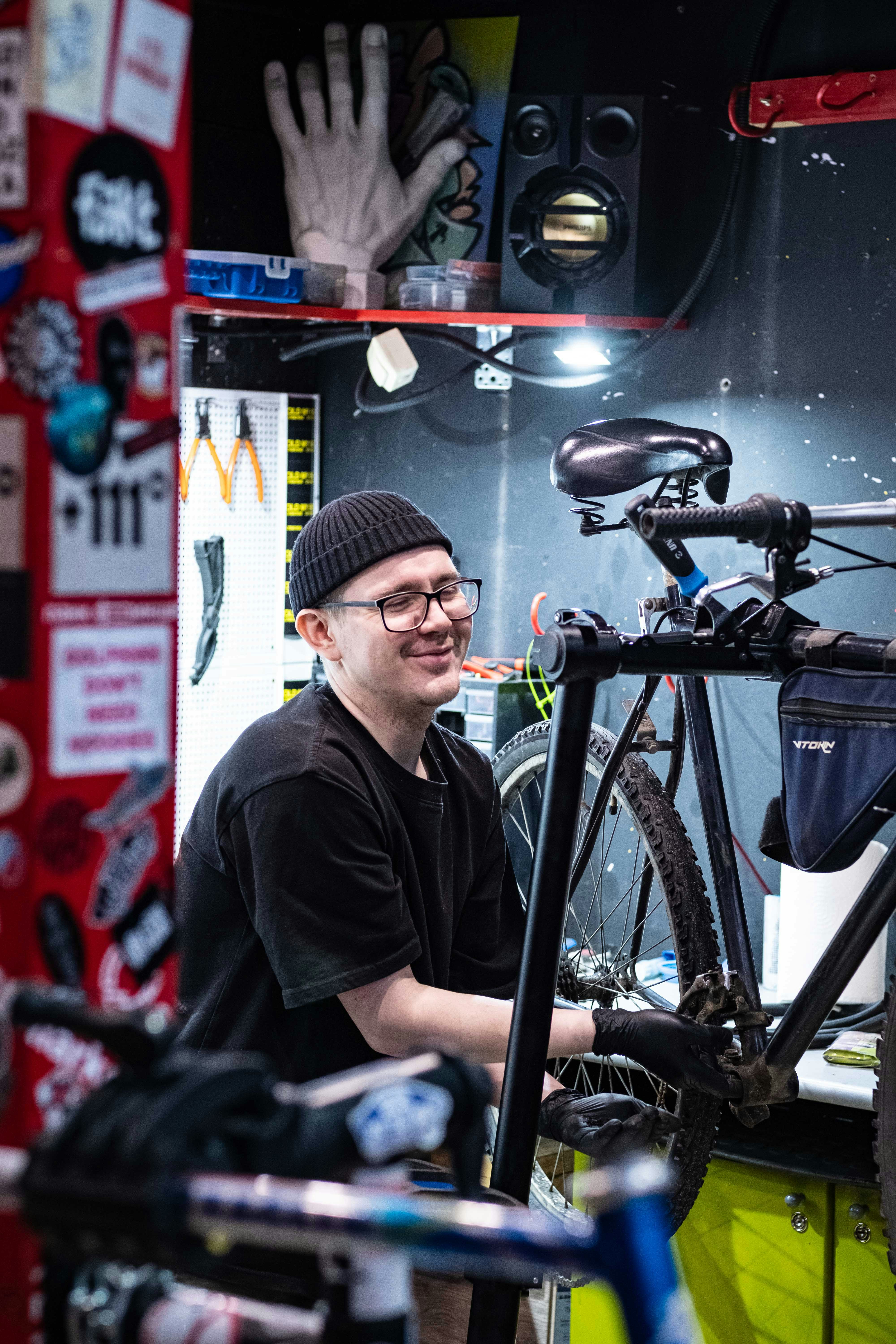 professional bike mechanic fixing a bike