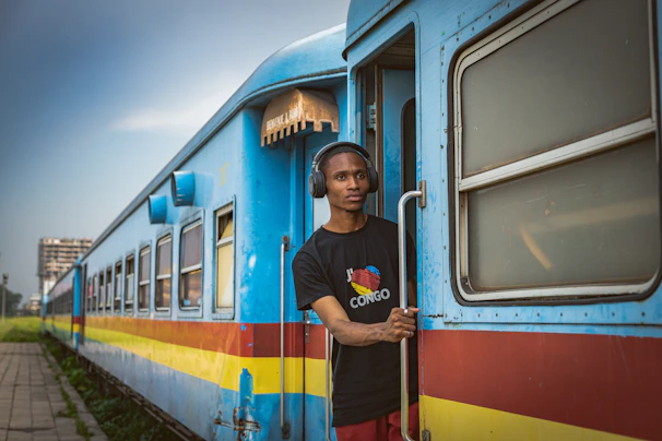 a man standing on the side of a train