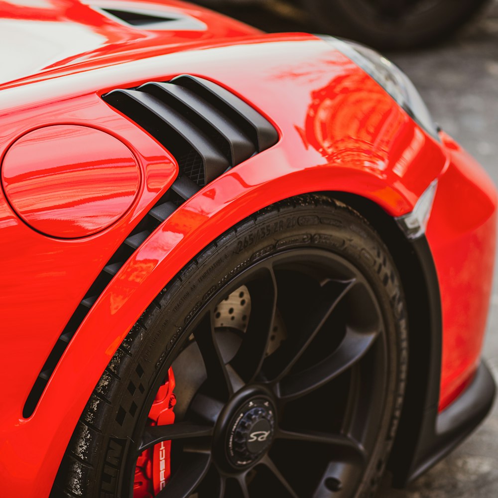 a close up of a red sports car