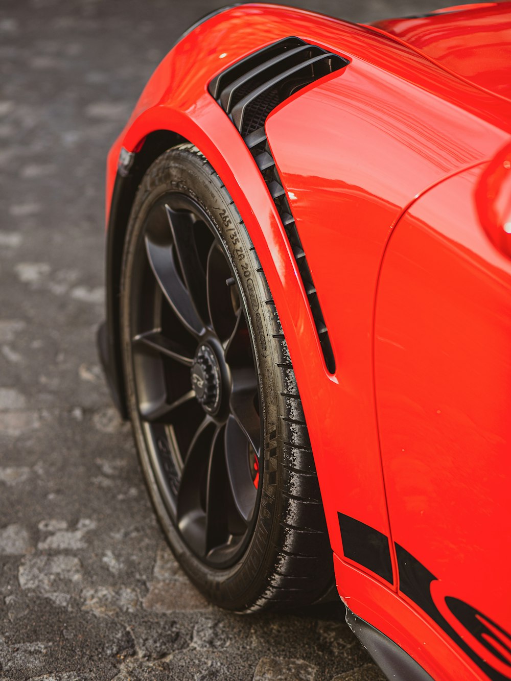 a close up of a red sports car