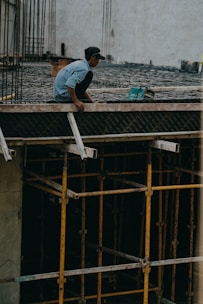 a man working on a building under construction
