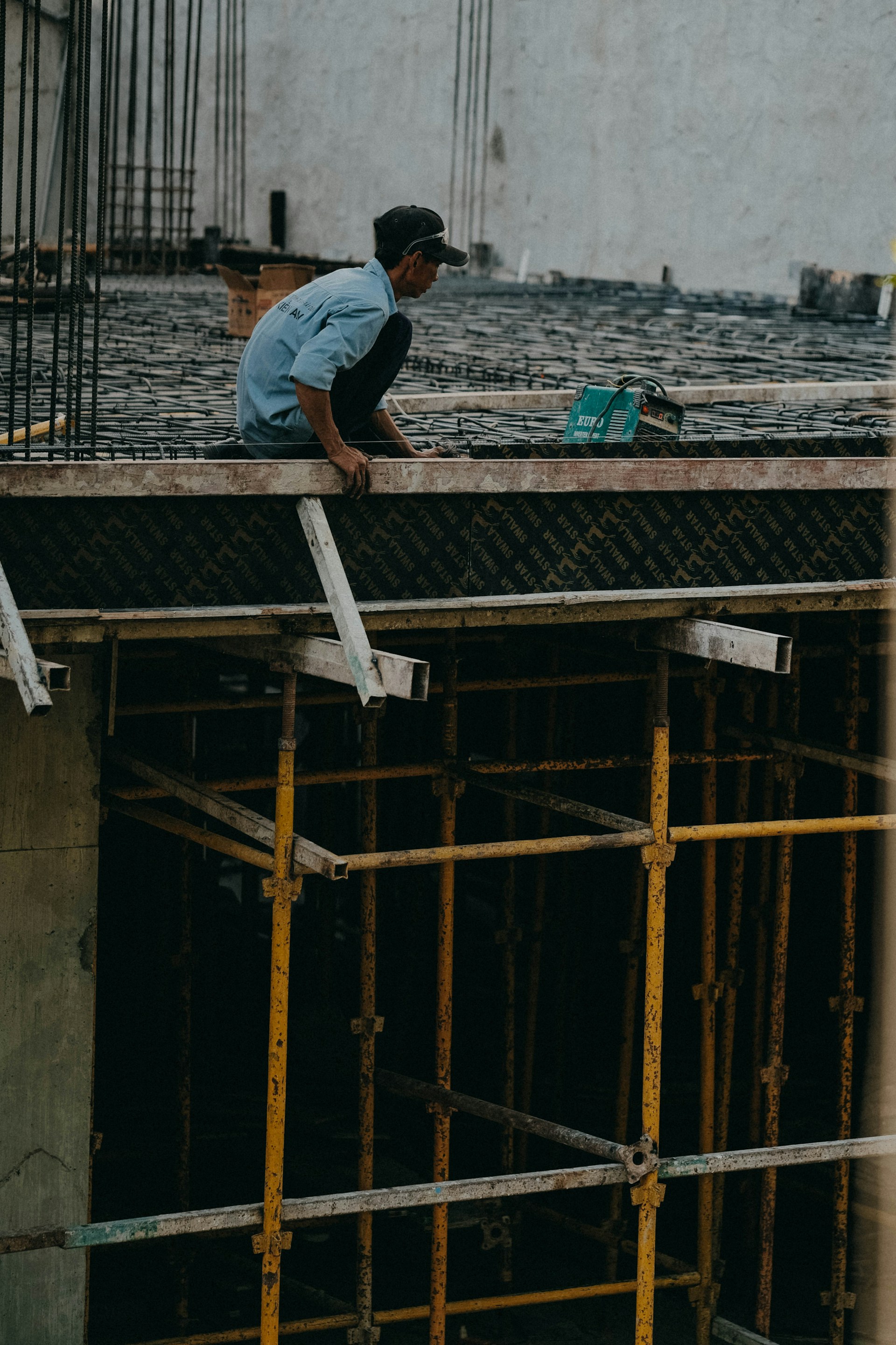 a man working on a building under construction