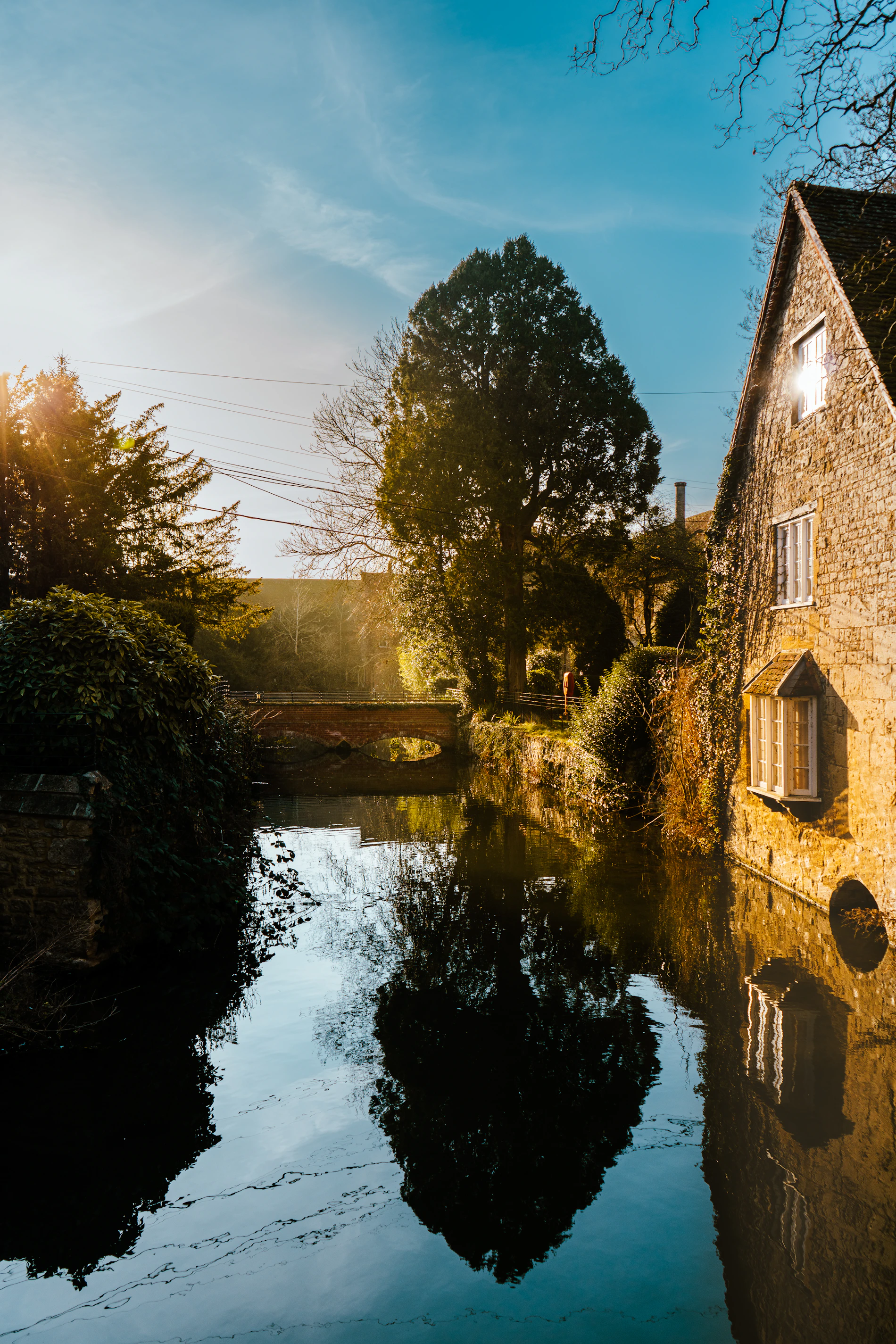 Countryside home beside water representing property lifestyle and thoughtful planning