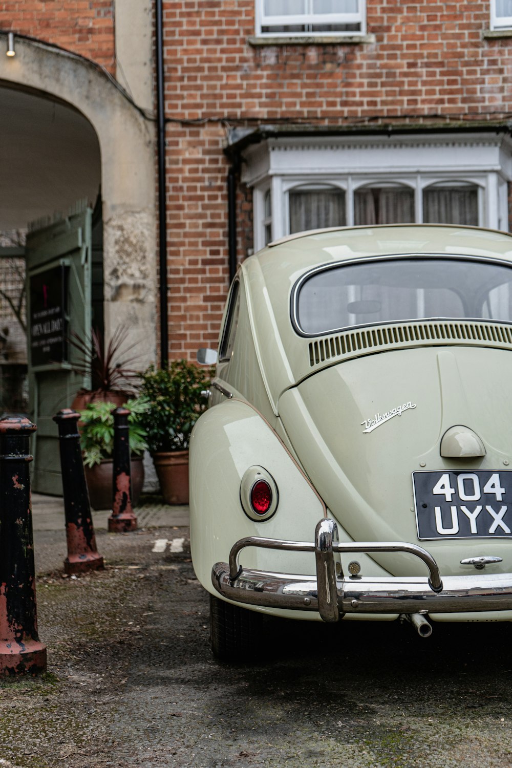 a car parked in front of a brick building