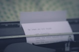 A close-up of a typewriter with paper.