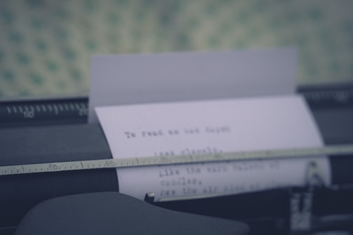 A close-up of a typewriter with paper.
