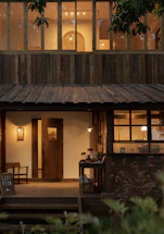 Cozy rustic restaurant entrance with welcoming lights at Rancho Pemaya
