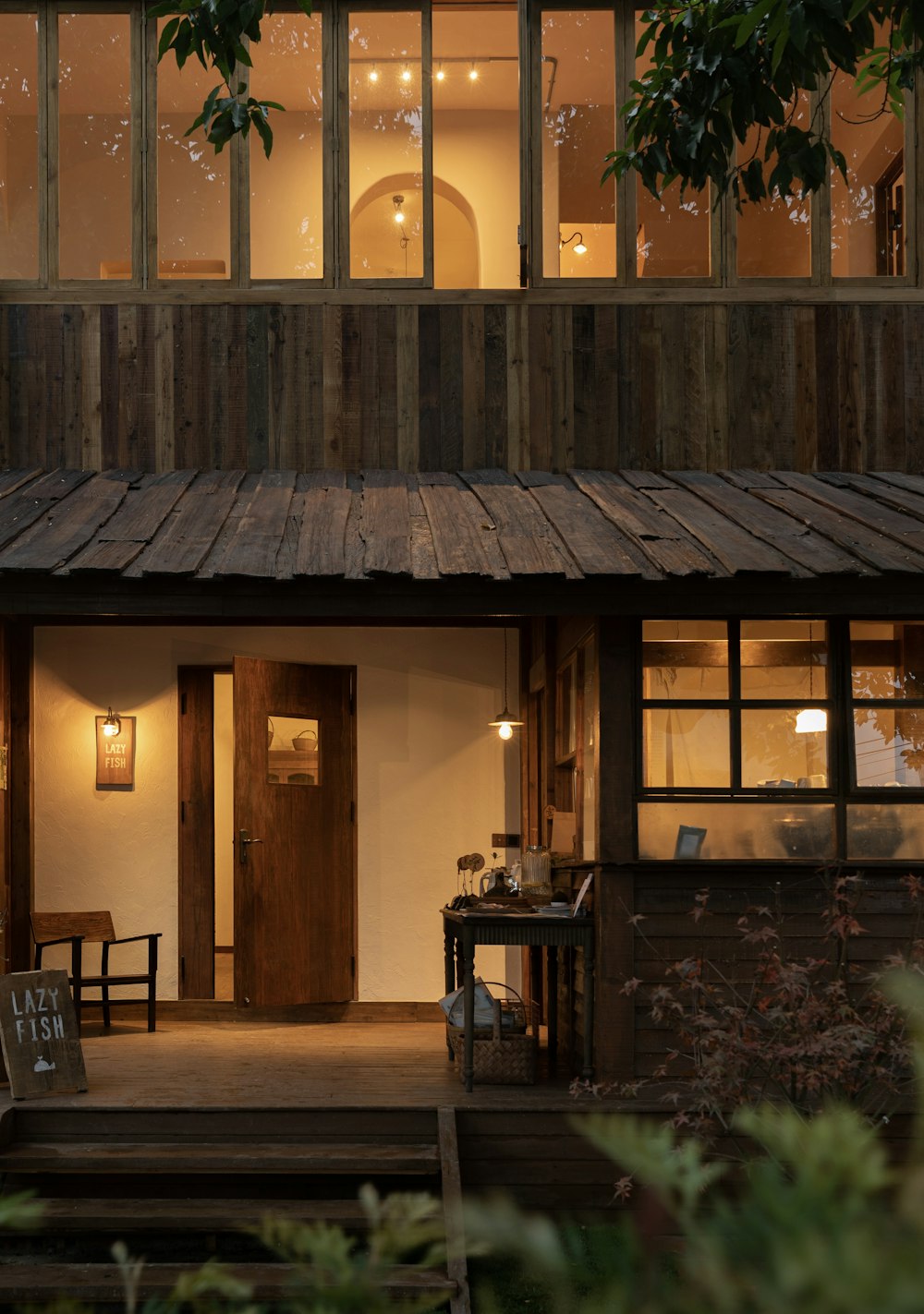 a house with a wooden porch and a wooden door