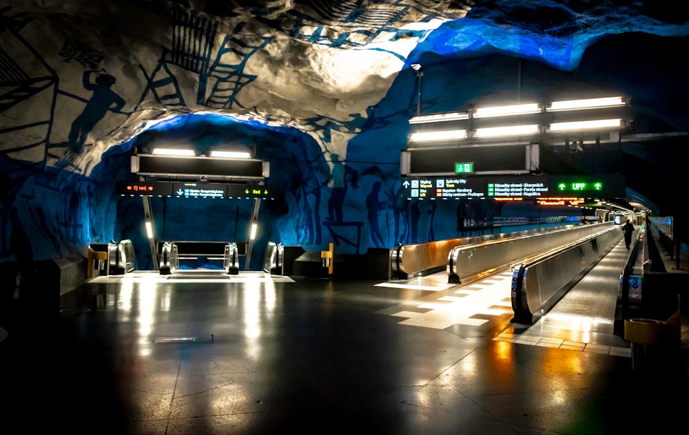 a subway station with graffiti on the walls