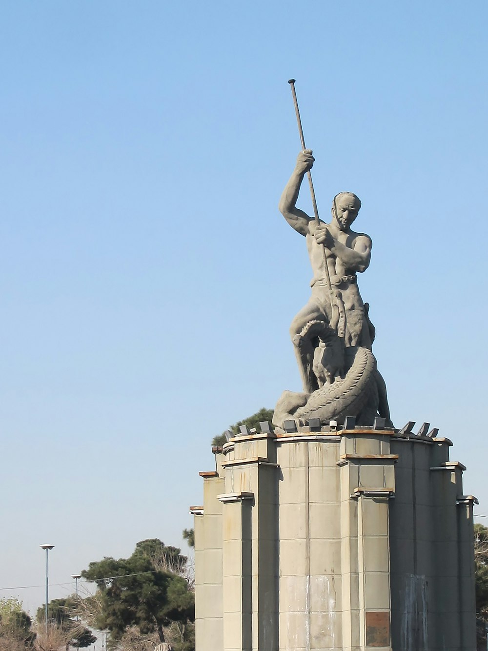 a statue of a man holding a baseball bat